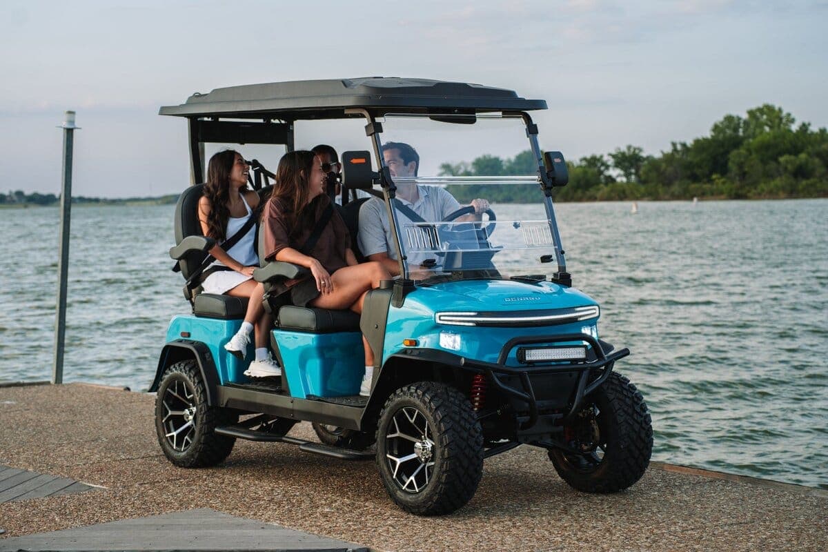 A Denago Rover XL golf cart by the water in the Shenandoah Valley